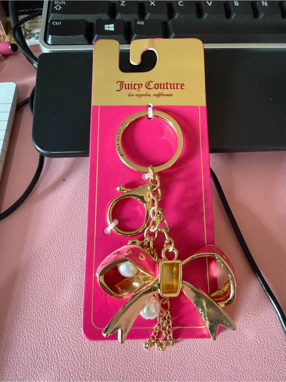 Juicy Couture Gold-Tone Bow Keychain with Pink Card Holder Backing